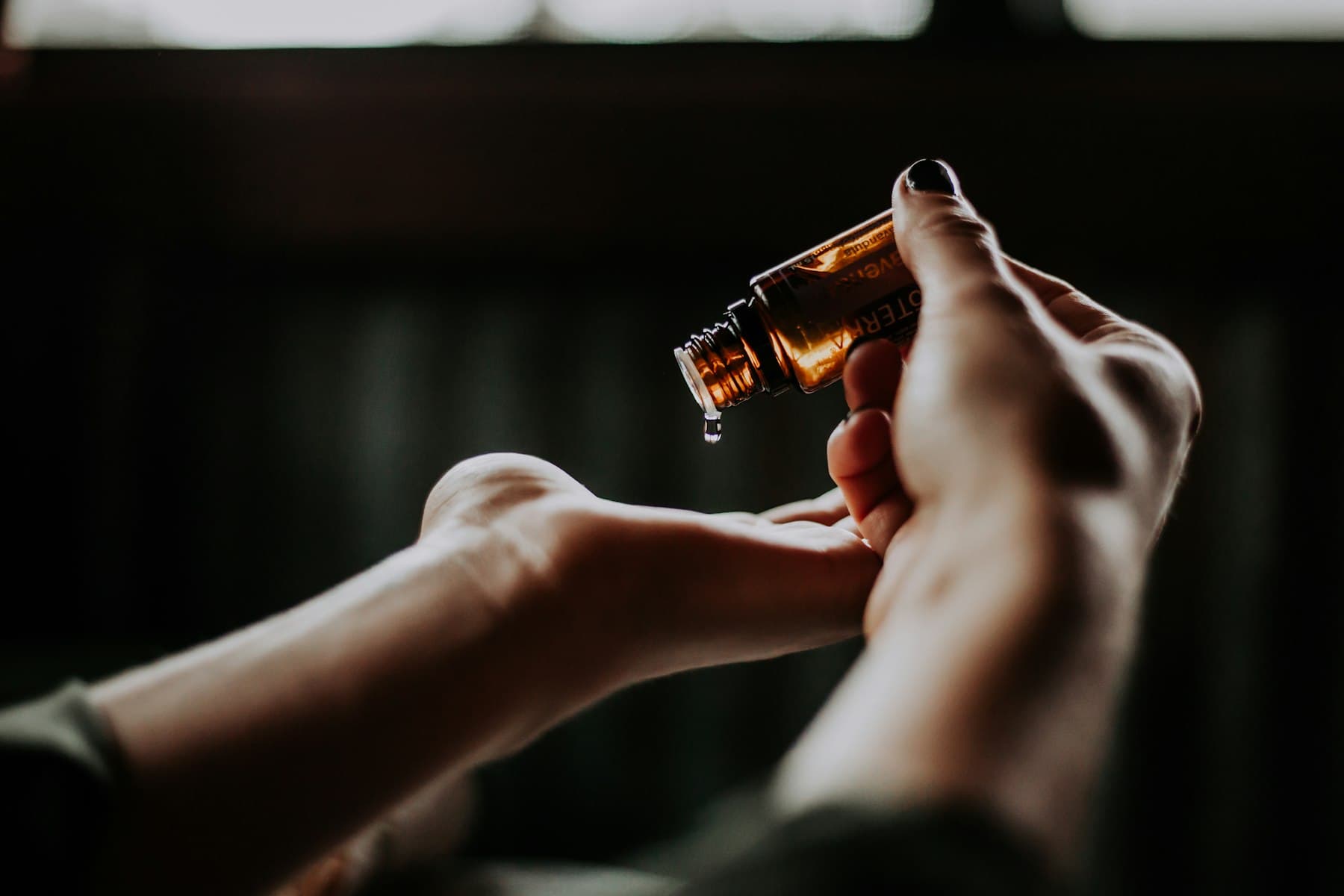 Clinical hands holding a dropper - mobile peptide therapy in DFW